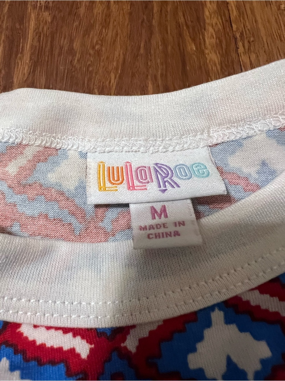 LuLaRoe White Raglan Top with Blue and Red Geometric Print - Picture 3 of 5